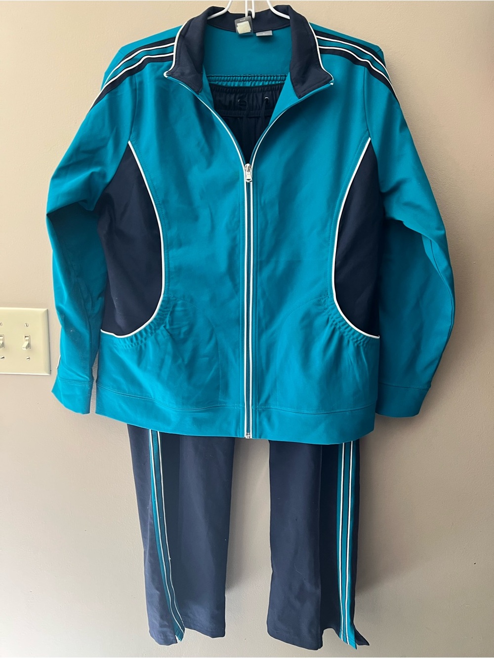 Retro SJB active tracksuit full length zip jacket with high collar. Teal & navy